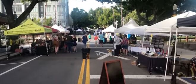 A bustling farmers market with local vendors and fresh produce